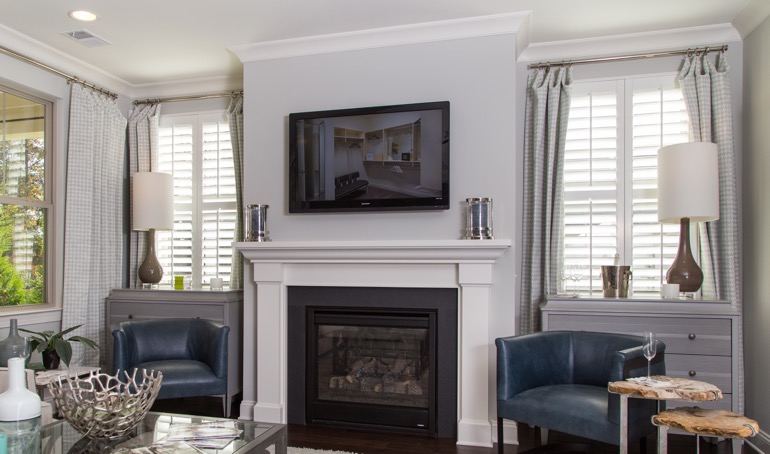 Minneapolis fireplace with white shutters.